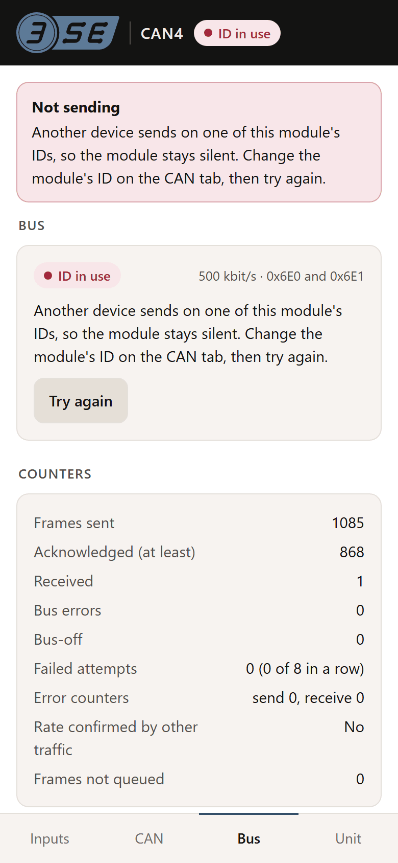 The Bus tab with another device on this module's status identifier: the status reads ID in use, a message says the module is not sending, and the advice asks for the ID to be changed on the CAN tab, with a Try again button.